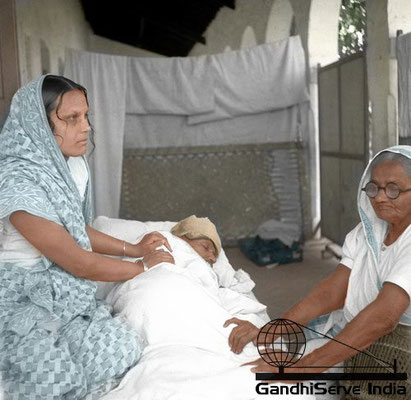 33 - Mahatma Gandhi being massaged by Vijyalaxmi Gandhi (wife of Purushottam Gandhi) and his sister Raliatbehn during his fast at Rashtriyashala Ashram, Rajkot, March 6, 1939.