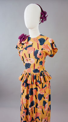  1940s style peplum Rayon dress in wonderful shades of Peachy Mustard, Navy, Black, Purple and Peach.