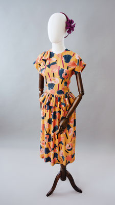  1940s style peplum Rayon dress in wonderful shades of Peachy Mustard, Navy, Black, Purple and Peach.