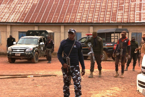 Policemen stand in front of a church in Kwatas village of Bokkos LGA after an attack by terrorists on 24 November 24 2022. Photo: Masara Kim
