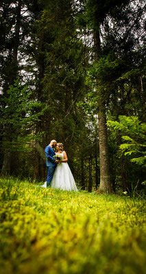 A moment for the couple in the woods