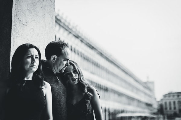 Documentary-style photo of Family in side canal at sunset in Venice