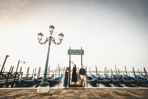 Professional Venice photographer composing shot in early morning light