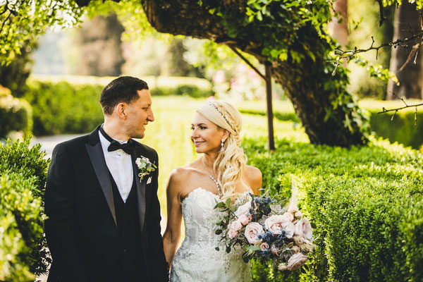 Intimate wedding moment between bride and groom in the Tuscan countryside