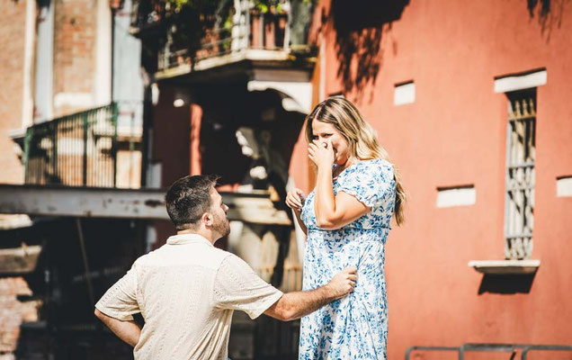 Couple during a surprise proposal in venice