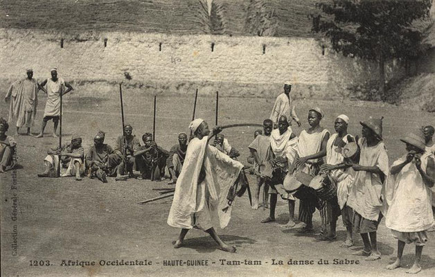 Jembe, tama (hourglass-drum), and flute players and warrior dance 