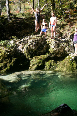 jumping in the mountain river. Slovenia