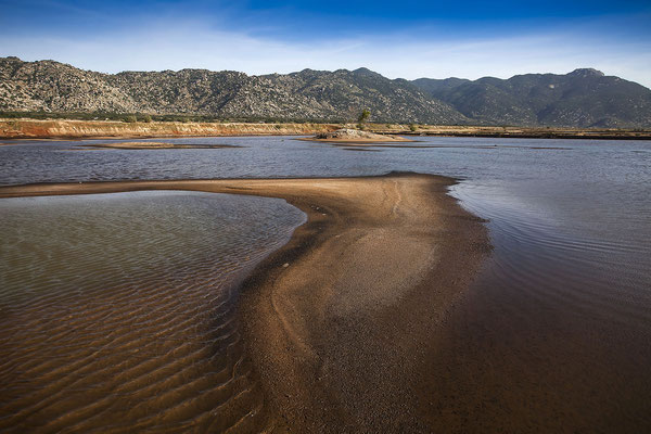 Mountainous coastal landscape near Ca Na, in the foreground an artificial lake for salt production, Ninh Thuan, Vietnam, Asia