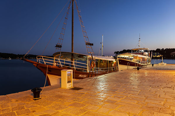 Excursion boats in the evening at the harbor of Poreč , Istria, Croatia, Europe