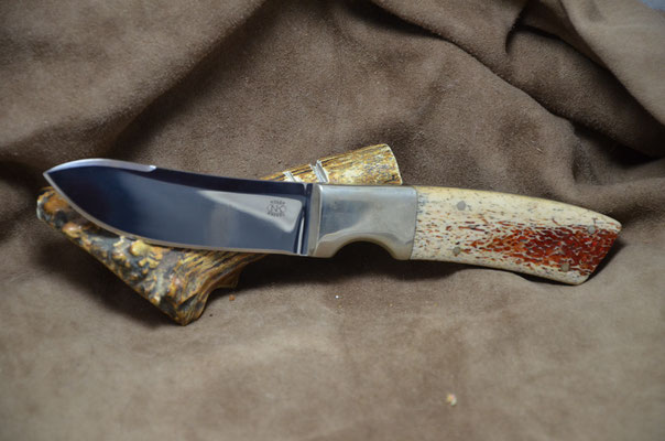 #231 Green River Skinner.  Blade length 4" Overall 8 7/8" Made with 440C.  Red Dyed Osic with nickel silver bolsters.  Maker RD Nolen $275