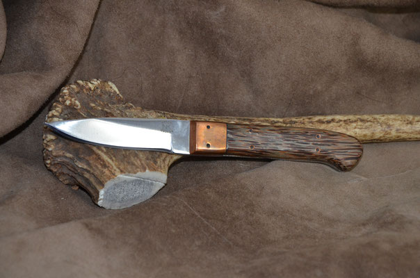 #176 Nolen caper.  Blade length 3" Overall 6 3/4" Made with D2.  Red Palm with copper bolster handle.  Maker Steve Nolen  $200