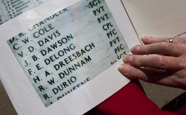 Air Force veteran Beverly Summers shows Frederick DeLong's name. DeLong was serving with the Marines when he lost his life in the Pearl Harbor attack and is entombed in the U.S.S. Arizona. (Cory Morse | MLive.com)