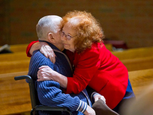 Air Force veteran Beverly Summers hugs WWII Navy veteran Richard Wellday Sr. during a ceremony remembering the 75th anniversary of Pearl Harbor at the Grand Rapids Home for Veterans on Wednesday, Dec. 7, 2016. (Cory Morse | MLive.com)