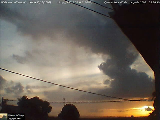 Pôr do Sol, Cumulus congestus e cortina de chuva em 05/03/2009.