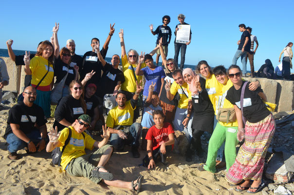 Group photo at the coast of Mediterranean sea, after the clean up