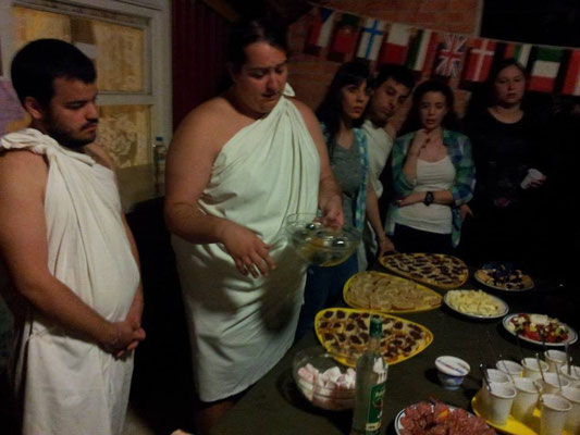 Greek participants sharing Greek traditional&tasty foods with other participants