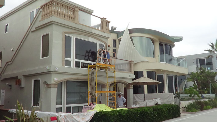 September 2015.  Beachfront Properties at Mission Beach in San Diego painted at the same time in 2007.  Beige House in the back painted with Ceramic InsulCoat Wall.  It is still pristine.  House in the foreground is being re-painted with EnviroCoatings.