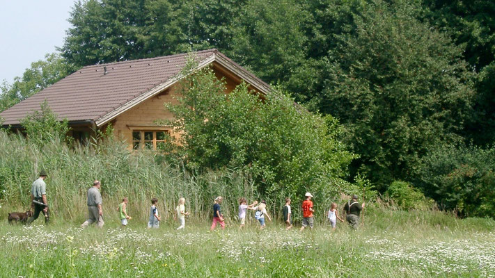 Brandner (neighbour) with schoolchildren on excursion passing the house. Picture 2