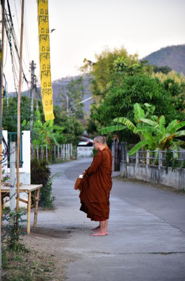 Merit making with buddhist monks