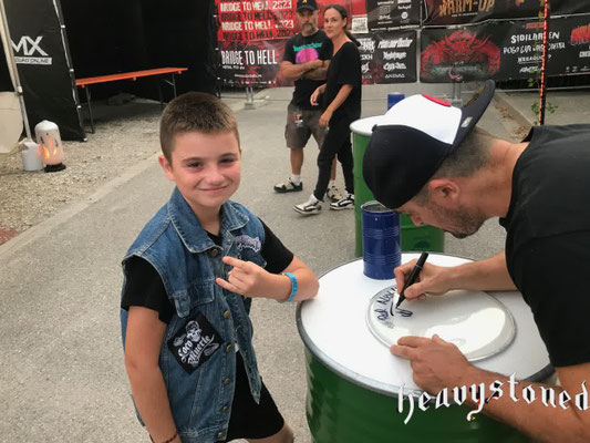 Joby signing a drumskin