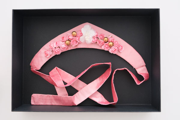 Regency-style kokoshnik hairband in pink silk laying in black box