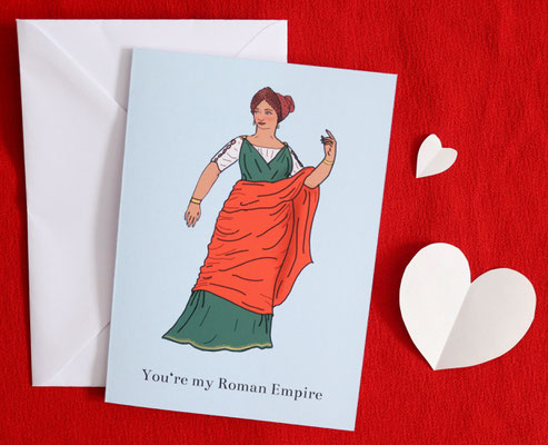 Roman fashion greeting card with envelope laying on red background with heart