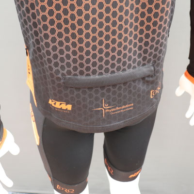 Custom long sleeve MTB jersey large rear pocket detail for practical trail riding storage.