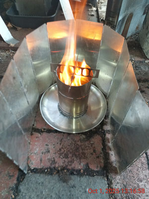 Navigator 'Light' V2 TLUD - 4" 304 chimney flue burner with cross piece stovetop, quench collector and heat and wind shield