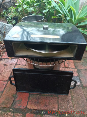 A '2 in 1' TLUD fired pizza oven and cast iron BBQ grill