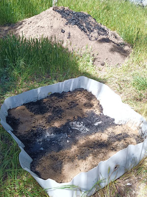 Biochar Mineral Complex (BMC) with medium crushed biochar, liquid sea kelp and blood and bone mixed together  in an IBC top