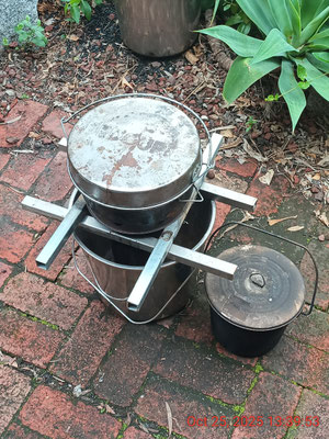 Navigator 'Awesome' V2 with "Bedourie" on top for cooking and frying, and a 5L stainless billy for water pasteurization
