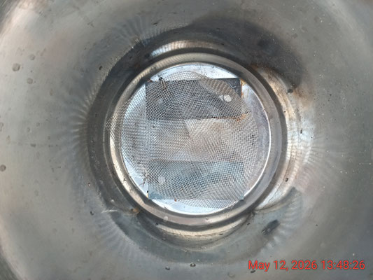 A fine 304 mesh cone positioned on 2 small mild steel blocks to enable higher primary air flow for longer burn time and ~100% biochar recovery - no fan needed