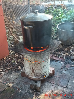 The TLUD in action with 14 litres of water pasteurised in 20 minutes (with some smoke)