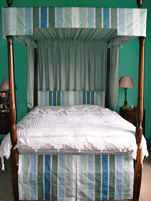 A dressed four poster bed