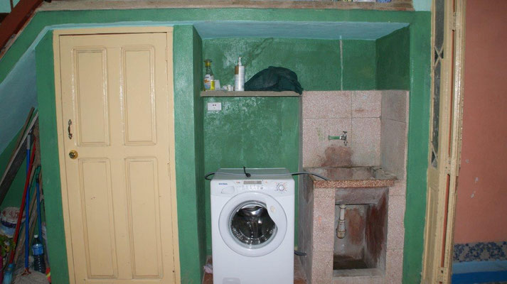 Patio with modern washing machine