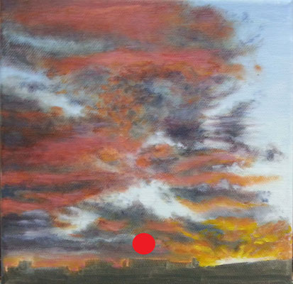 Cielo crepuscular con nubes intensas en tonos rojos, morados y anaranjados sobre un horizonte oscuro.