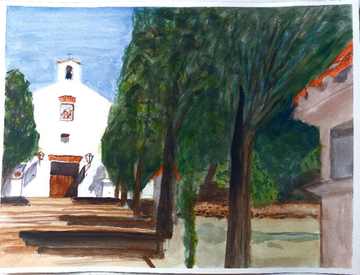 Ermita de Santo Domingo en Petrés, al final de un camino arbolado con luz clara y cielo azul.
