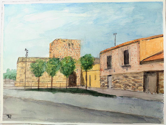 Torreón fortificado y edificaciones tradicionales del Grau Vell, con árboles y cielo claro.