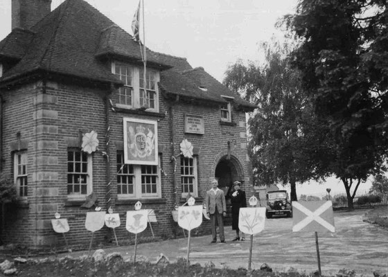 Headmaster Fred Tulett in front of the school on Coronation day.