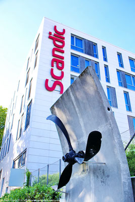 An art monument with propeller stands close to the hotel 