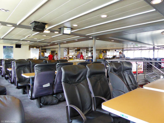 The interior of the ferry Fjord Cat with seats and tables in the first class on the passage from Hirtshals to Kristiansand