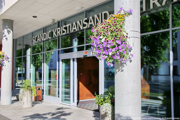 Street entry of Scandic Kristiansand Bystranda with nice flowers