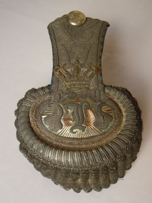 This is called an "Epaulette", which is part of a uniform jacket worn on top of its shoulder(s). About 150 years old. It is actually silver-coated,...