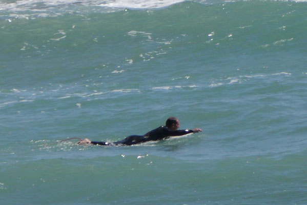 Surfer vor Palmira Beach