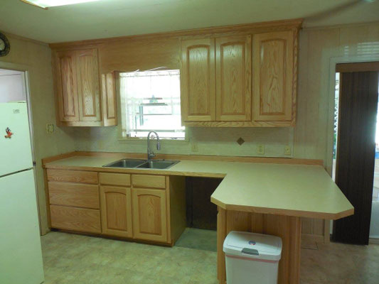 Cabinets done in Red Oak with Natural finish & Formica Countertops