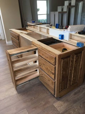 Cabinets done in Ash with "Chocolate" stain & lacquer finish. Built in Spice Rack in Island