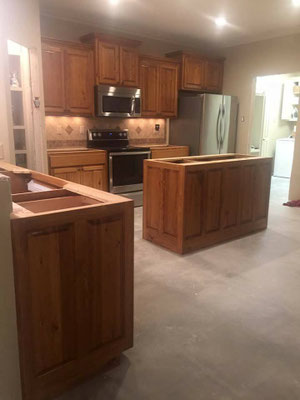 Cabinets. Cypress in kitchen. The kitchen uppers were pre-existing (survived the flood) & Jim built the replacement lowers to match. 