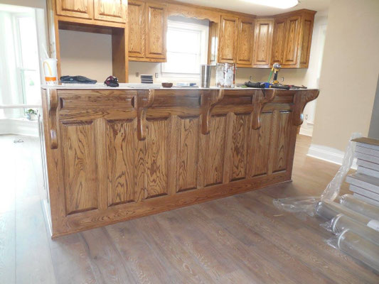 Cabinets done in Ash with "Chocolate" stain & lacquer finish. Back of Island