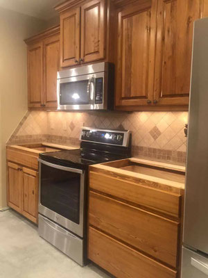  Cabinets. Cypress in kitchen. The kitchen uppers were pre-existing (survived the flood) & Jim built the replacement lowers to match. 