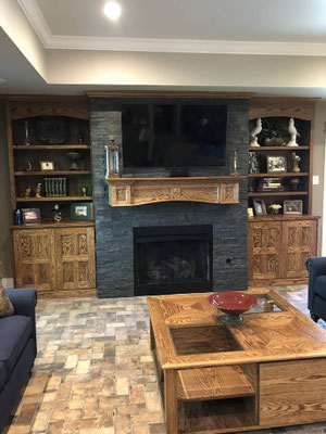 Jim added the doors & crown to the existing bookcases and also custom built the mantel, coffee table, and side table for this customer